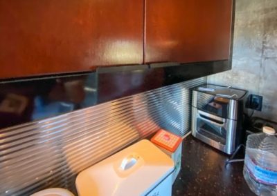 A unique metal backsplash installed during a kitchen remodel