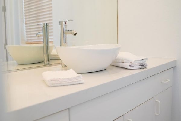 A chic basin sink that has been installed during a bathroom remodel