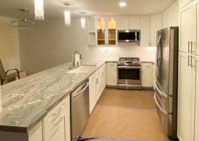 A newly remodeled kitchen with new granite countertops